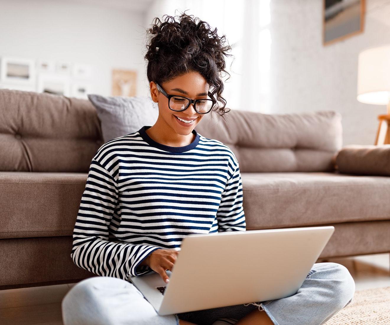 Women on laptop using PayPal